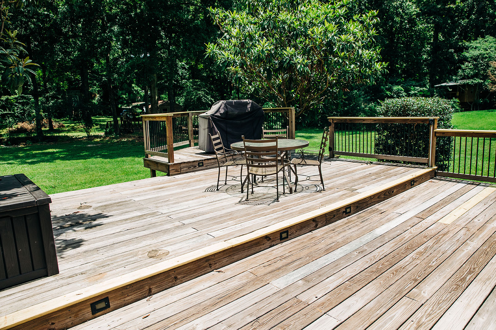 Large worn wooden deck needing renovation and staining Large worn wooden deck needing renovation and staining